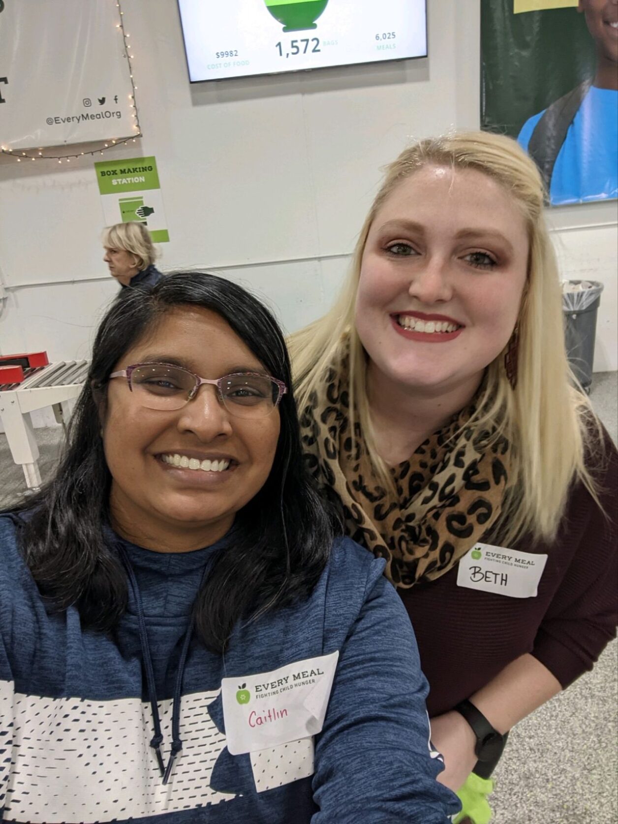 Two female Turnberry employees pose for a photo at a Every Meal event