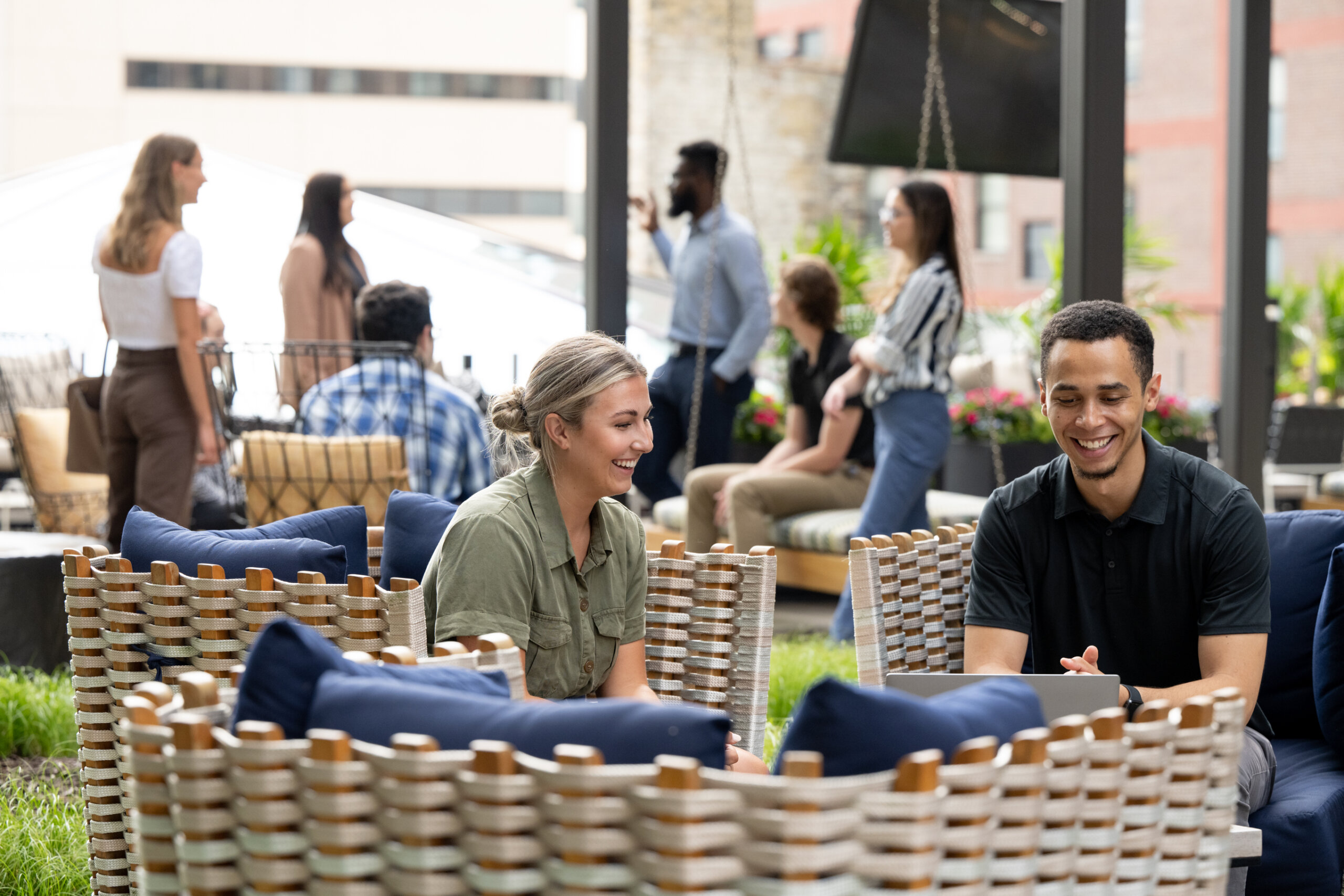 Several Turnberry professionals enjoy the modern outdoor space of Turnberry's modern offices