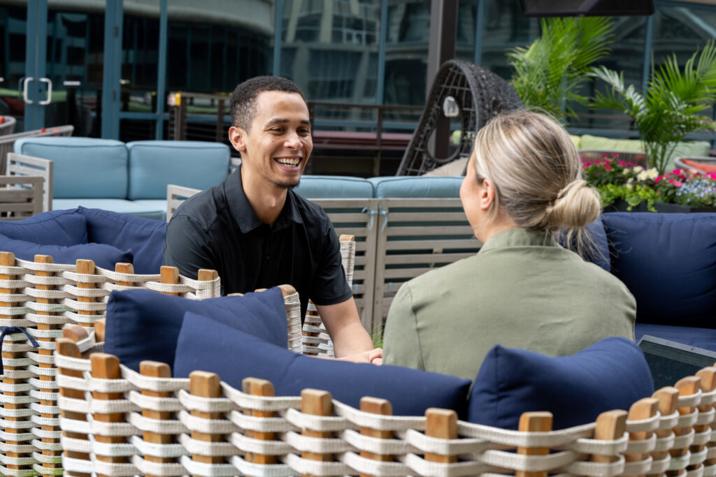 Two Turnberry professional converse at Turnberry's outdoor space in Minneapolis, Minnesota