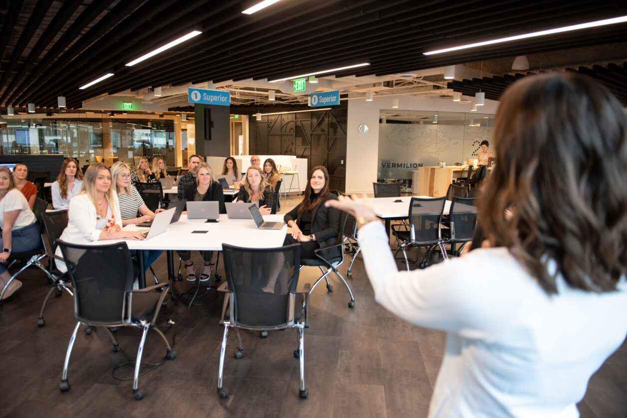 Turnberry team members enjoy a presentation at Turnberry's modern offices in Minneapolis, Minnesota