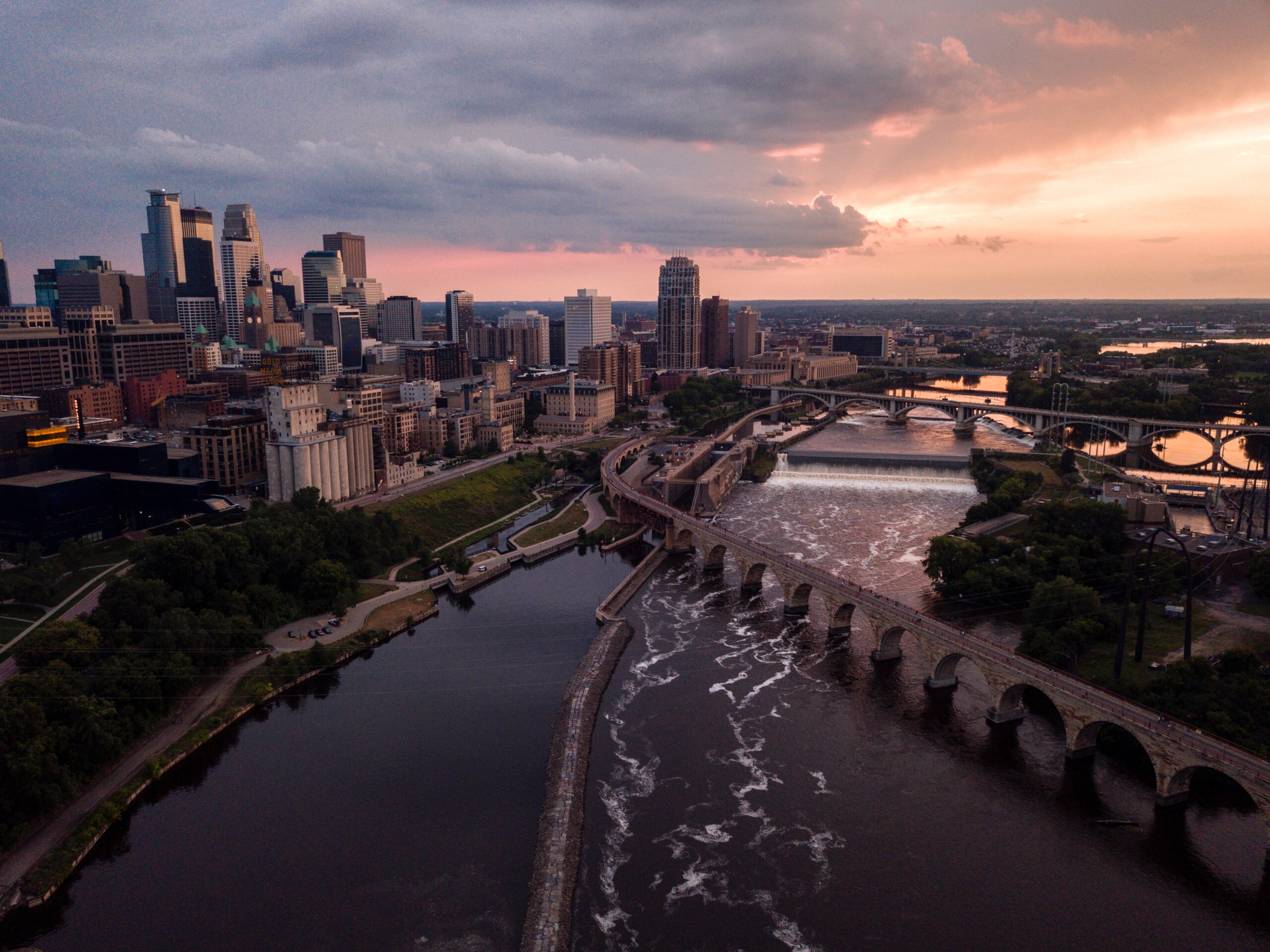 Aerial view of downtown Minneapolis from the East at sunset showing the Mississippi River