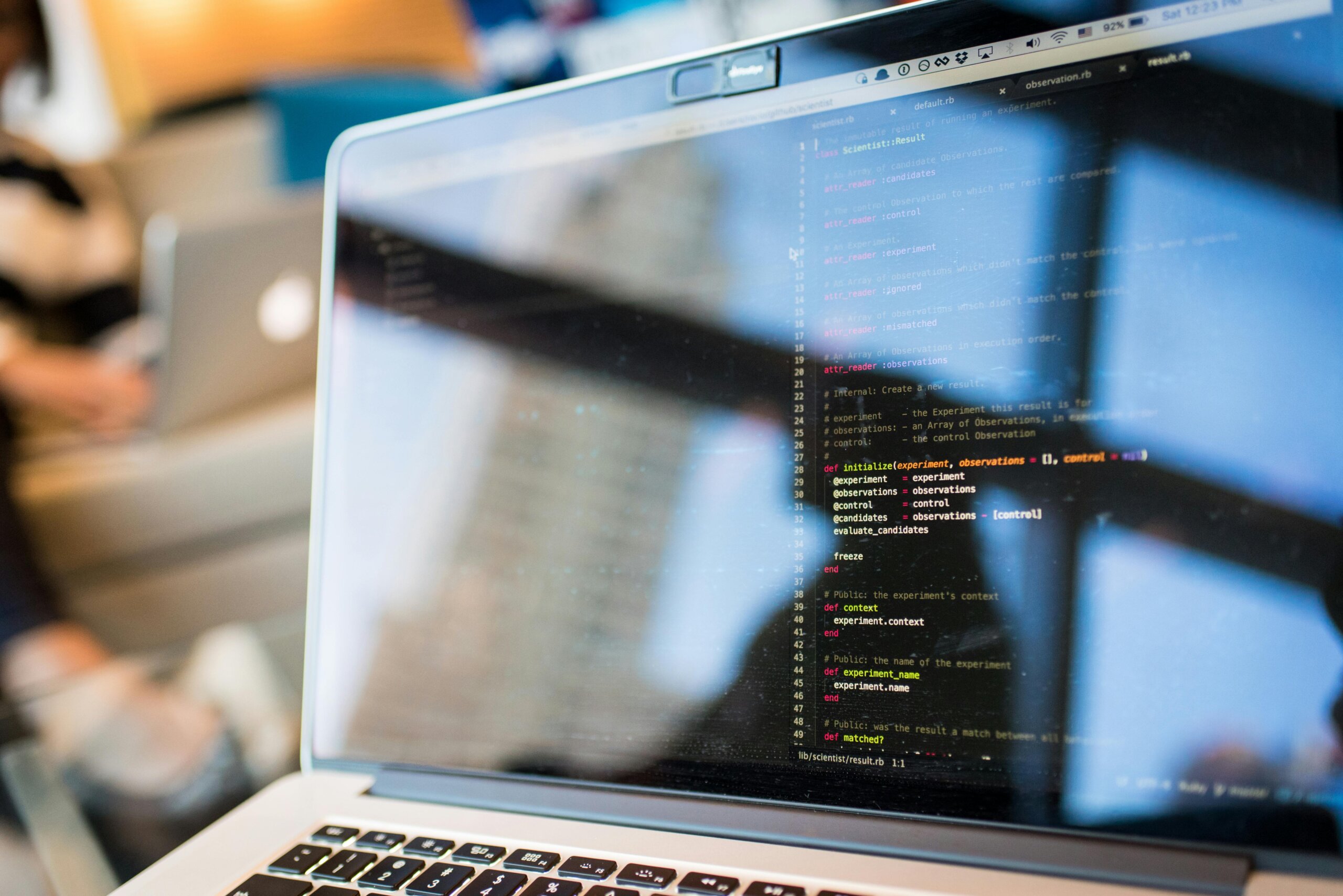 Code for predictive battery maintenance software displayed on laptop
